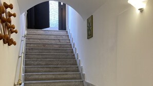 A staircase with a handrail, leading to an upper floor. - apartment/ flat - with a large terrace overlooking the sea (Taormina)
