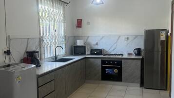 Coffee/tea maker, fridge, microwave, oven