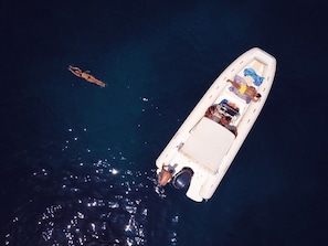 A boat with a covered deck and a motor at the stern. - Anna's House. (Balestrate)