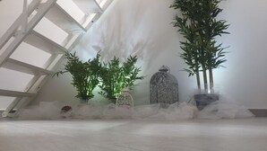 A room with a sloped ceiling, a large window, and a decorative lantern. - Casa Anna 800 meters from the SEA .... (Balestrate)