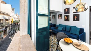 A narrow urban street with a balcony overlooking a tiled courtyard. - Varò Apartment (Taormina)