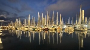 A marina with numerous sailboats docked, reflecting on calm water under a twilight sky. - LE BIGORNEAU IMPRENABLE VIEW of the MORGAT CROZON BEACH (Crozon)