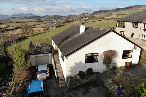 Aerial view showing the house and setting