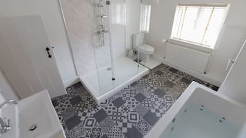 Bathtub, jetted bath, hair dryer, towels