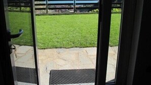 A door leading to a balcony with a view of a lake and mountains. - Villa with large garden and super breathtaking panorama, relaxation, peace (vercana)