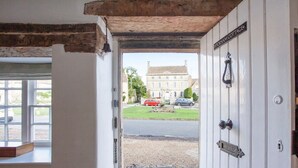 A doorway leading to a street with a sign reading 'WICKHAM COTTAGE'. - Charming Country House Nr Bath (WC) (Biddestone)