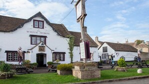 A traditional white building with a sign reading 'The White Horse.' - Charming Country House Nr Bath (WC) (Biddestone)