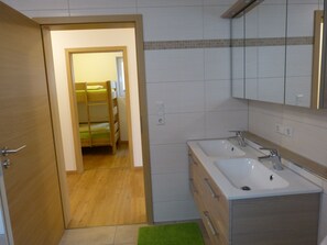 Bathtub, hair dryer, towels, soap