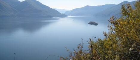 A calm lake surrounded by mountains.