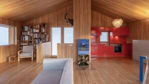 A modern loft with a wooden interior, a cozy seating area, a kitchen with red cabinets, and a fireplace. - Exclusive design chalet on 1 800 meters, 4-6 pers.,  above Törbel (Törbel)