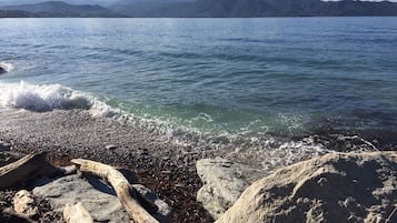 On the beach, sun-loungers