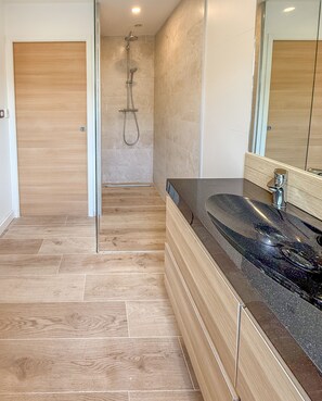 Shower, hair dryer, towels, toilet paper