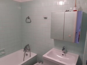 Bathtub, hair dryer, bidet