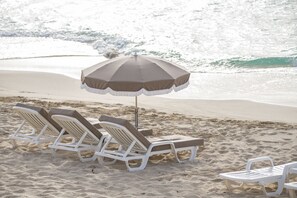 On the beach, sun loungers, beach towels - Wonderful, brand new flat with a large terrace on the beachfront (Grand-Case)