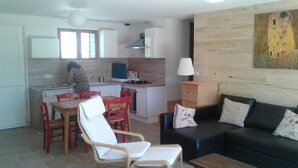 A modern apartment with a kitchen, dining area, and living room. - Promo end of August 25% 3 bedroom cottage of 85m2 with south facing terrace of 60m2  (Saint-Cyr-La-Roche)