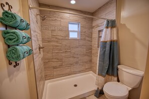 Shower, hair dryer, towels, soap