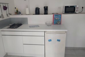 Fridge, microwave, stovetop, coffee/tea maker