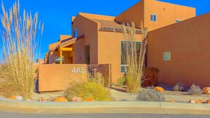 A modern building with a flat roof and a sign reading "4A5".
