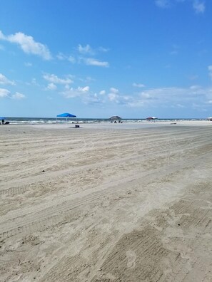 On the beach, sun loungers, beach towels