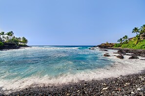On the beach, sun-loungers