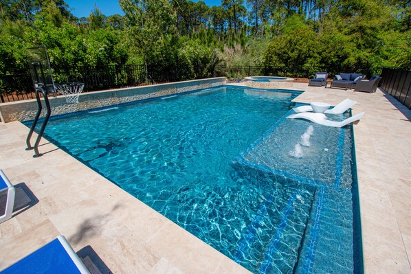 Outdoor pool, a heated pool, sun loungers