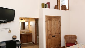 A bedroom with a bed, a desk, a chair, a wardrobe, and a television. - 4 BR/4 BA Townhome - Spacious, comfortable, the perfect getaway! (Park City)