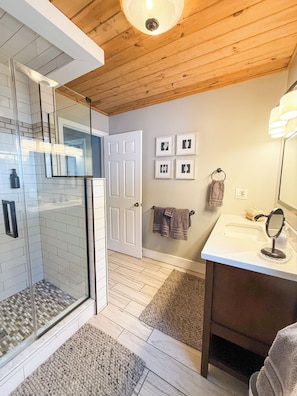 Shower, hair dryer, towels, toilet paper