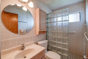 Shower, hair dryer, towels, toilet paper