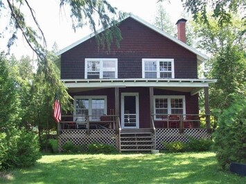 A view of the Cottage from Caspian Lake beach...only a few feet to the water!
