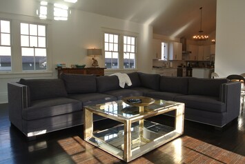 Beautiful open plan living area, with high ceilings and  bright natural light.