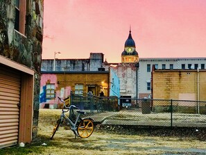 Standing tall, a historic building with a striking clock tower offers a glimpse into the city's rich past.