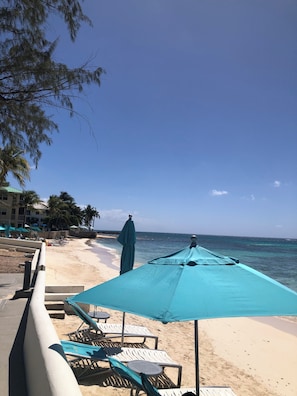 On the beach, sun-loungers, beach towels