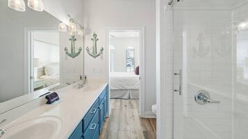 Shower, hair dryer, towels, toilet paper