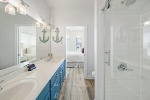 Shower, hair dryer, towels, toilet paper