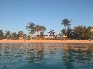 On the beach, sun-loungers, beach towels