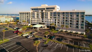 A multi-story hotel with a parking lot and a view of the water. - Oh what a view - 711A !!!! (Gulf Shores)