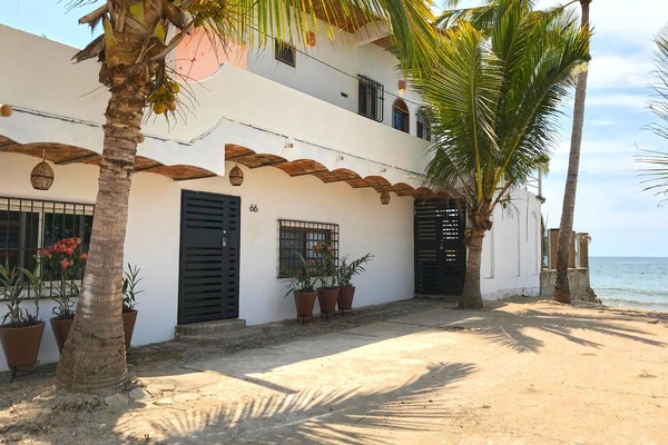 The front of La Esquina Perezosa with our new landscaping and beach access.