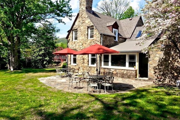 The Red Bridge Lodge Rear patio w/ Old Red Bridge in background.