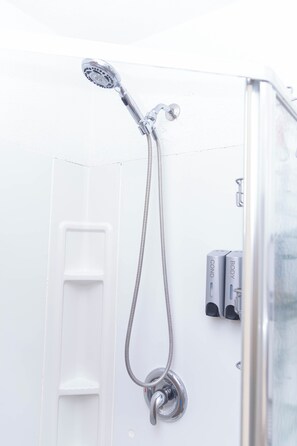 Bathtub, hair dryer, towels, soap