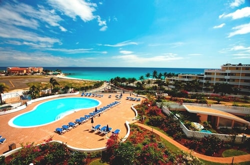 Clean & Fresh:  Beautiful White Sands of Maho Bay with views of planes landing