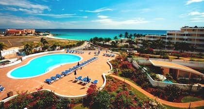 Clean & Fresh: Beautiful White Sands of Maho Bay with views of planes landing