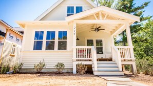 A two-story house with a covered porch and a number '214' on the front. - Modern Farmhouse Just Steps From Town and Lake Michigan w/Heated Pool! (New Buffalo)