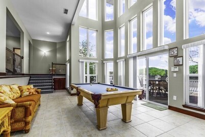 Spectacular 6 bedroom home with open floor plan on deep quiet water