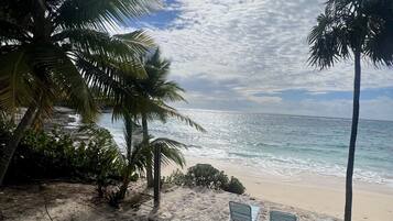 On the beach, sun loungers, beach towels