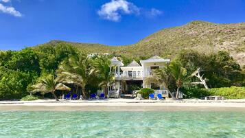 On the beach, sun loungers, beach towels