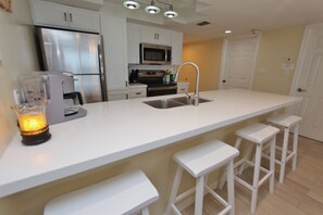 Fridge, microwave, oven, stovetop - Experience the ocean views at Dreams of Atlantis - Condo 502, a 2BR retreat in South Padre Island. (South Padre Island)
