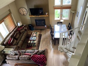 Smart TV, fireplace, books, printers