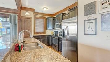 Dishwasher, coffee/tea maker, cookware/dishes/utensils, dining tables