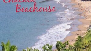 A beach with a sign reading "Chacala Beachhouse". - Beach Front Compound W/Casita & Private Terrace: Sleeps 4@$45 a nite per person (Chacala)