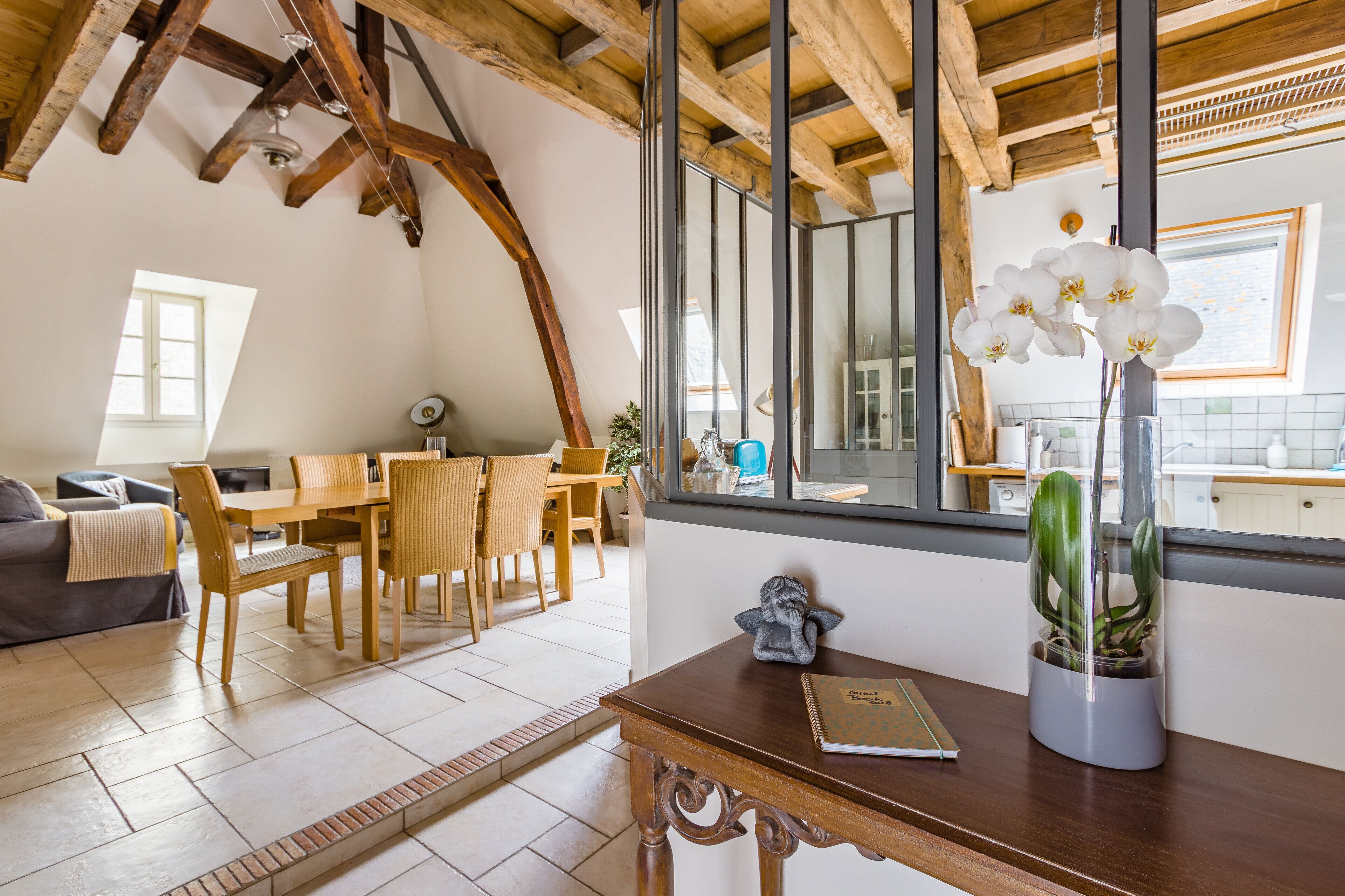 View from the entrance of the apartment. Living room (left) and kitchen (right).